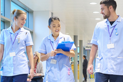 nhs staff walk through the corridor picture thumb 250 x 167